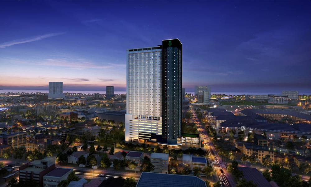 The Torre Sur condominium is captured in a view of city lights.