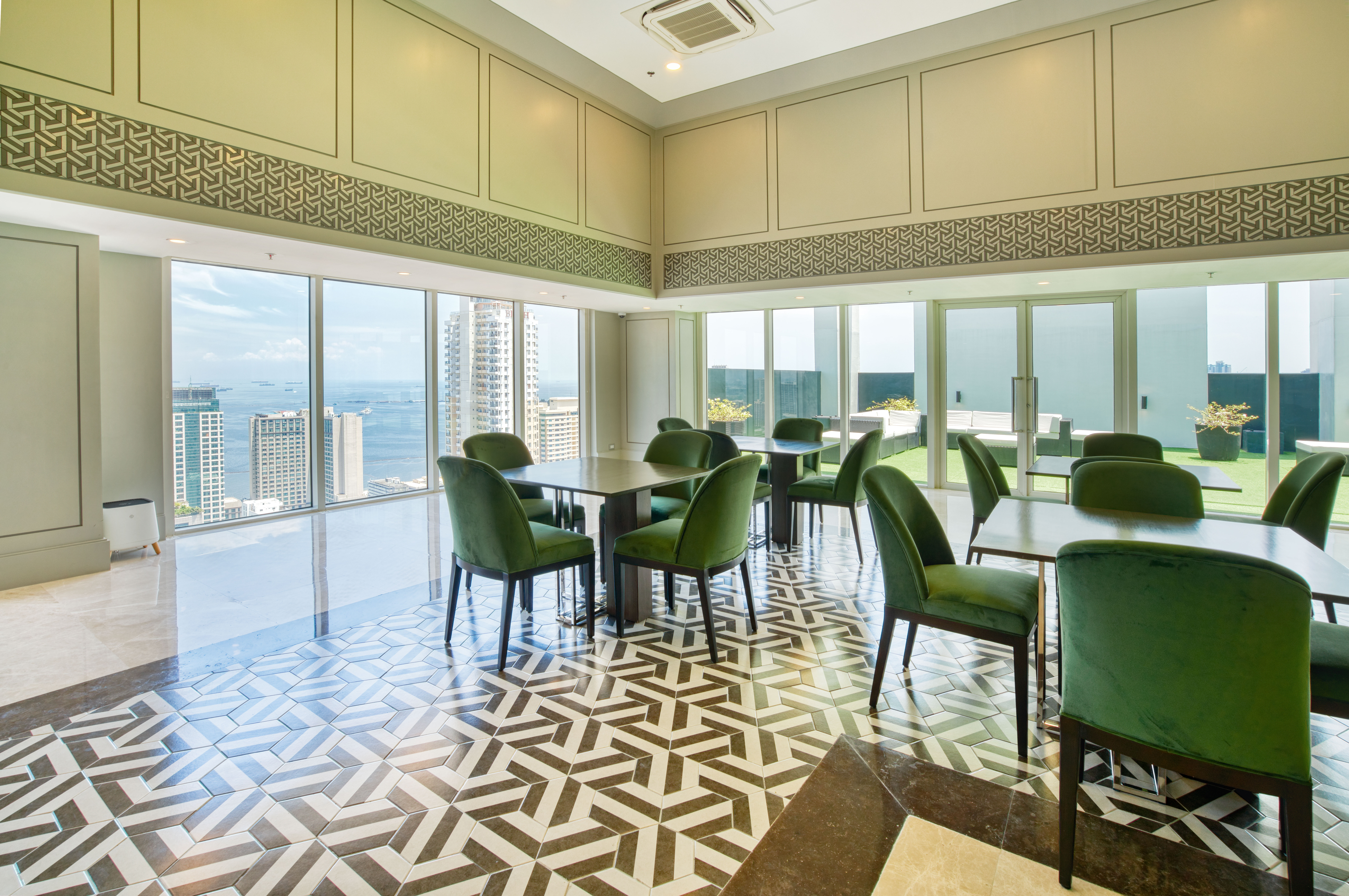 Torre Lorenzo Malate sky lounge area: vintage modern design tiles and furniture