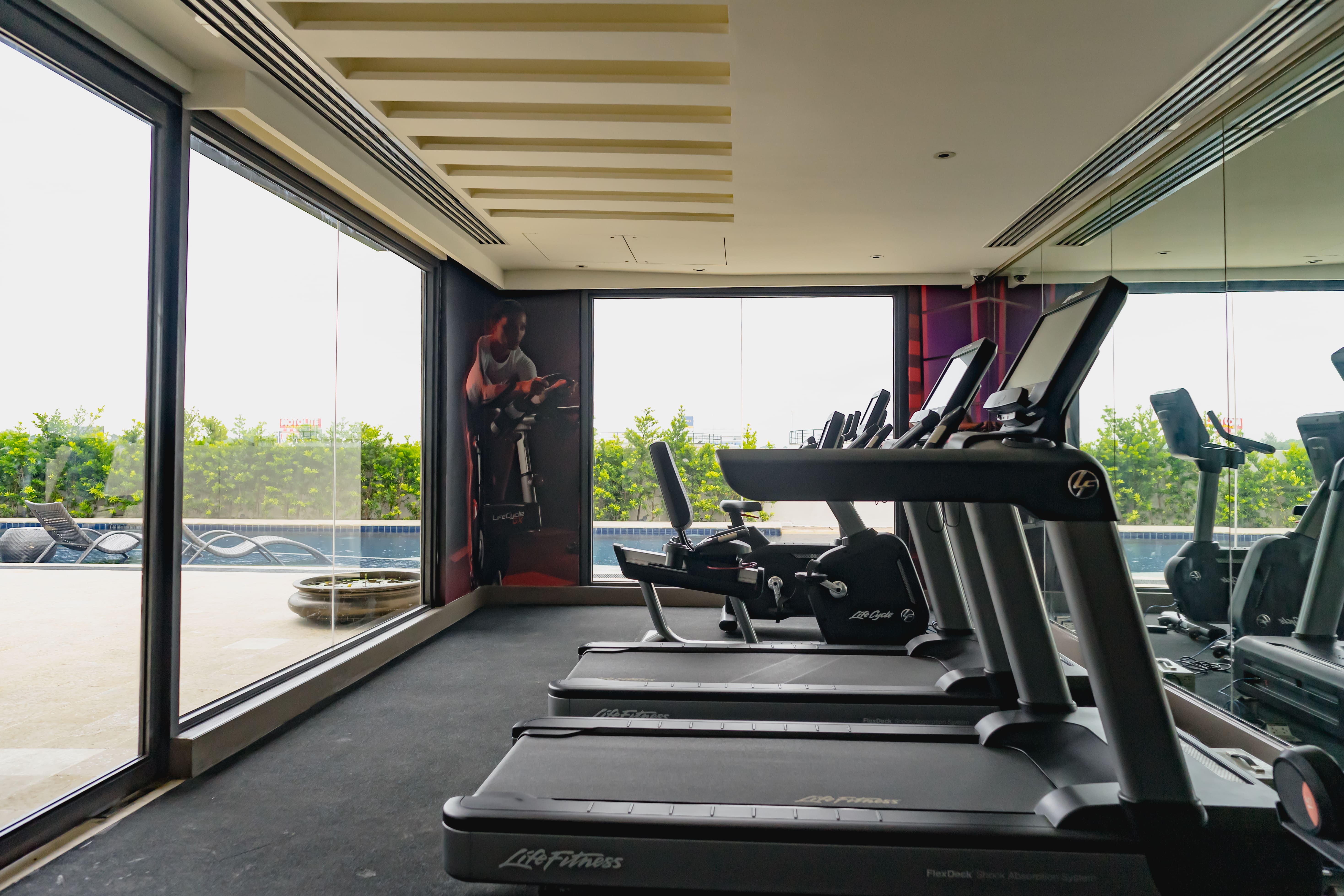 a condo amenity with treadmills and exercise machines