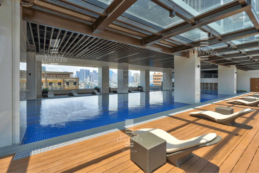 a pool with lounge chairs and a deck at 3Torre Lorenzo